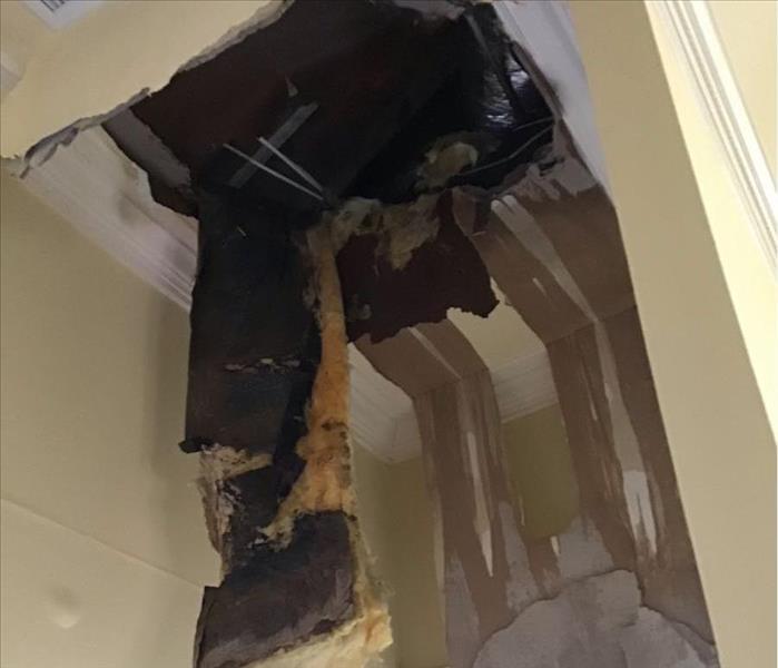 Ceiling that collapsed with hole in it