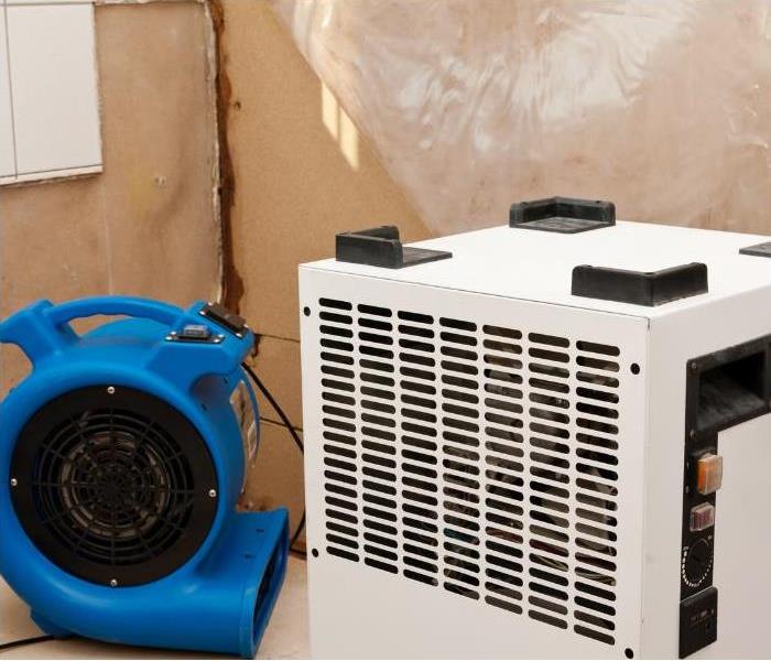 Examples of our advanced technology for drying water damage, blue fan, and white fan