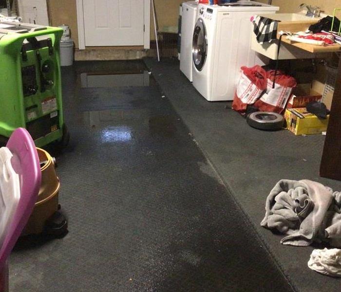 Laundry Room with Water on the carpet