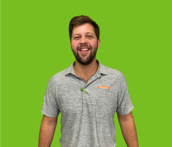 Male SERVPRO Owner on green background